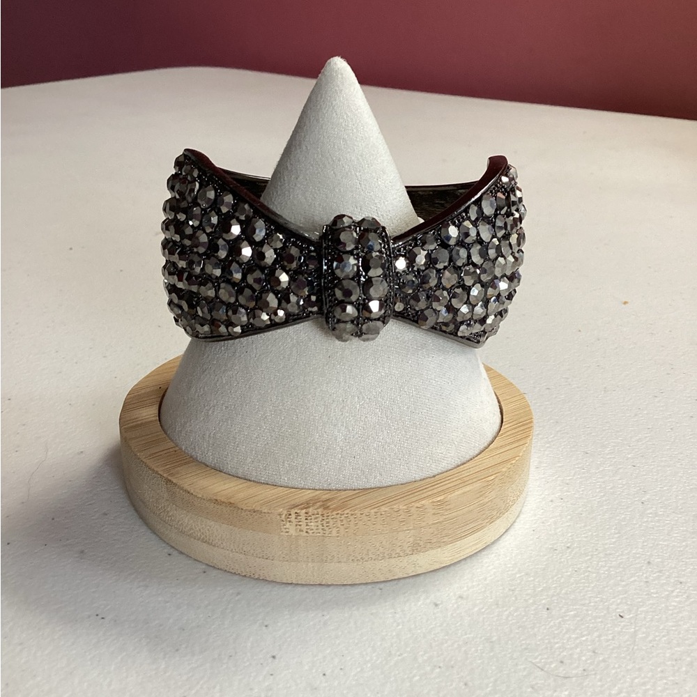 Kirks Folly black rhinestone adorned bow hinged bracelet